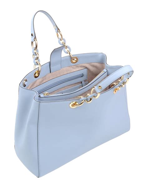 michael kors large blue leather bag gold accents|small white Michael Kors bag.